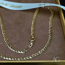 Elegant 18k gold cuban chain necklace with polished curb design and lobster clasp