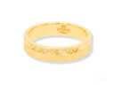 Elegant 18k gold diamond wedding band with seven channel-set diamonds