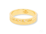 Elegant 18k gold diamond wedding band with seven channel-set diamonds