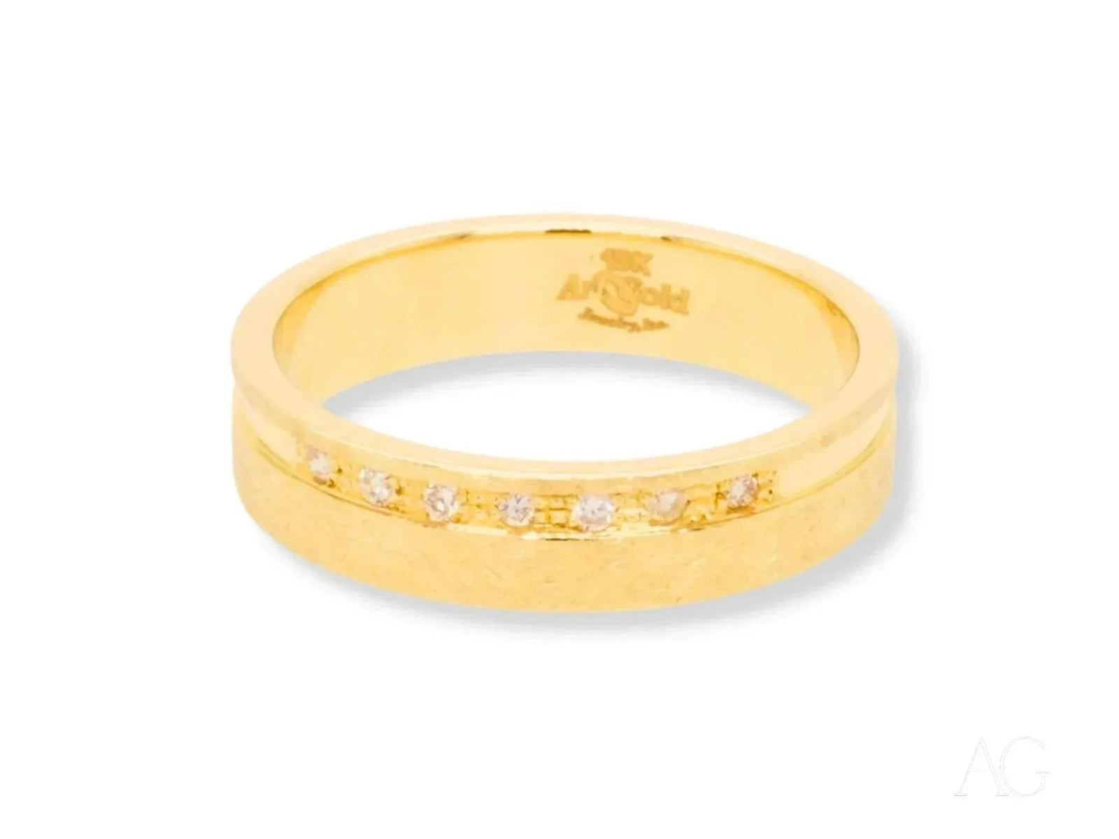 Elegant 18k gold diamond wedding band with seven channel-set diamonds