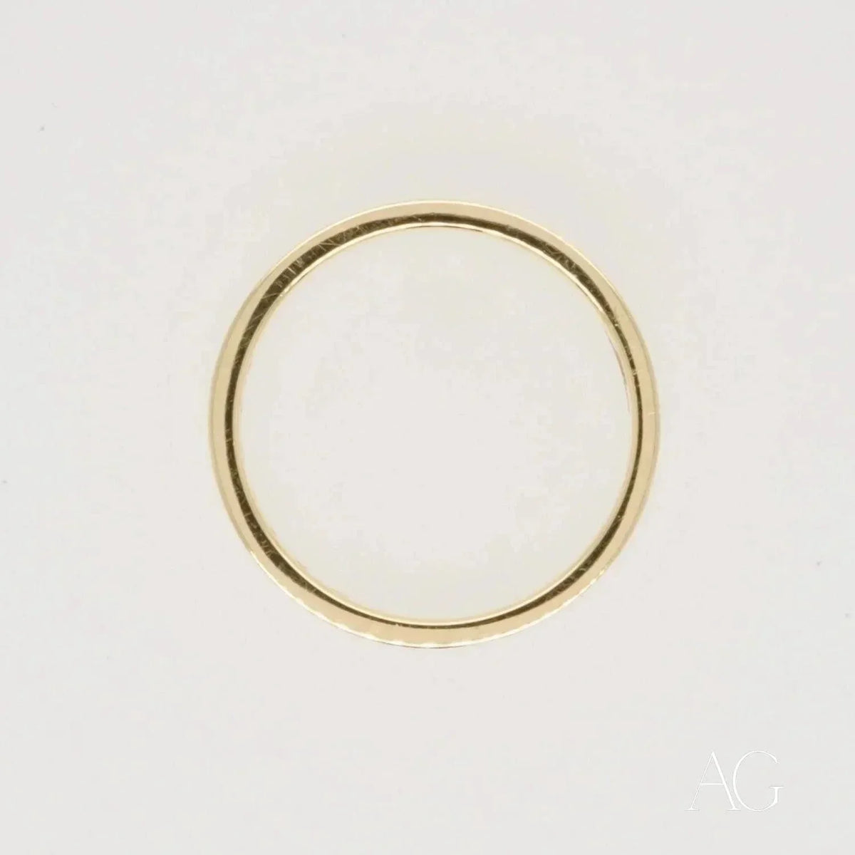 Elegant 18k gold diamond wedding band with thin simple design