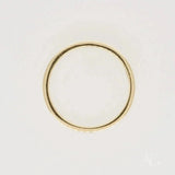 Elegant 18k gold diamond wedding band with thin simple design