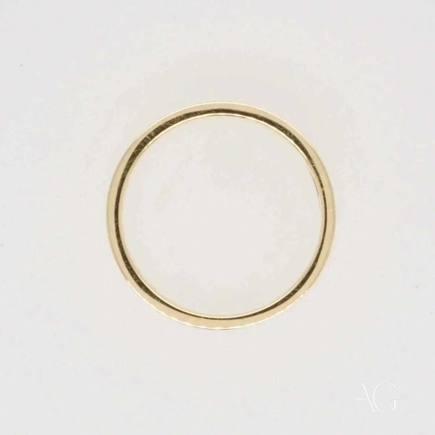 Elegant 18k gold diamond wedding band with thin simple design