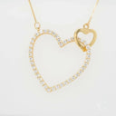 Elegant 18k gold heart necklace with gemstone pendant