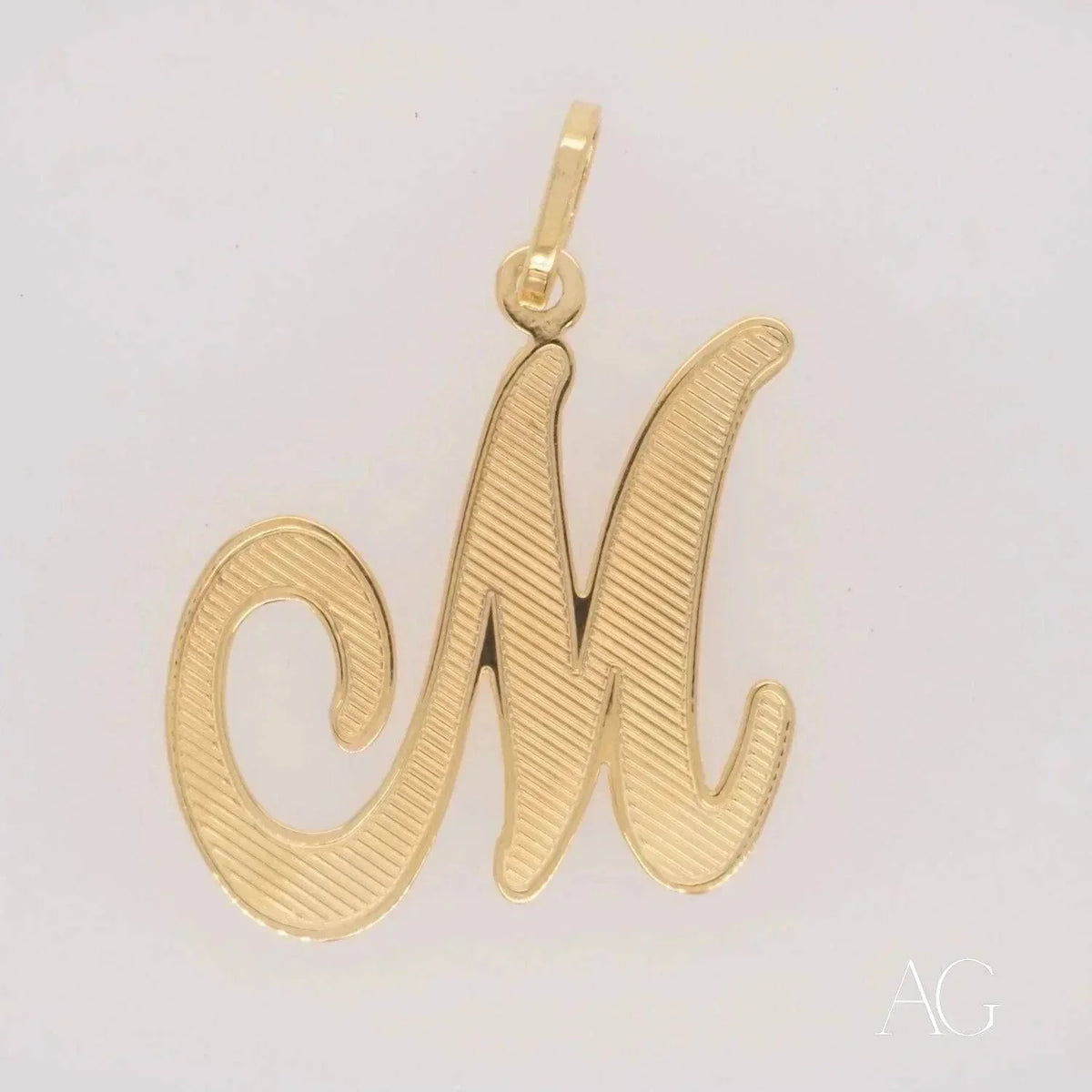Elegant 18k solid gold letter M pendant with textured finish