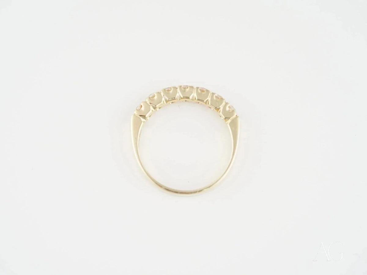 Exquisite 18k yellow gold ring with five round-cut diamonds, timeless elegance