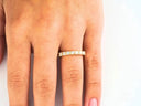 Elegant 18k yellow gold eternity band with square-cut diamonds for timeless elegance