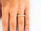 Elegant 18k yellow gold eternity band with square-cut diamonds for timeless elegance