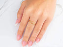 Elegant 18k yellow gold heart ring with pavé diamonds on hand