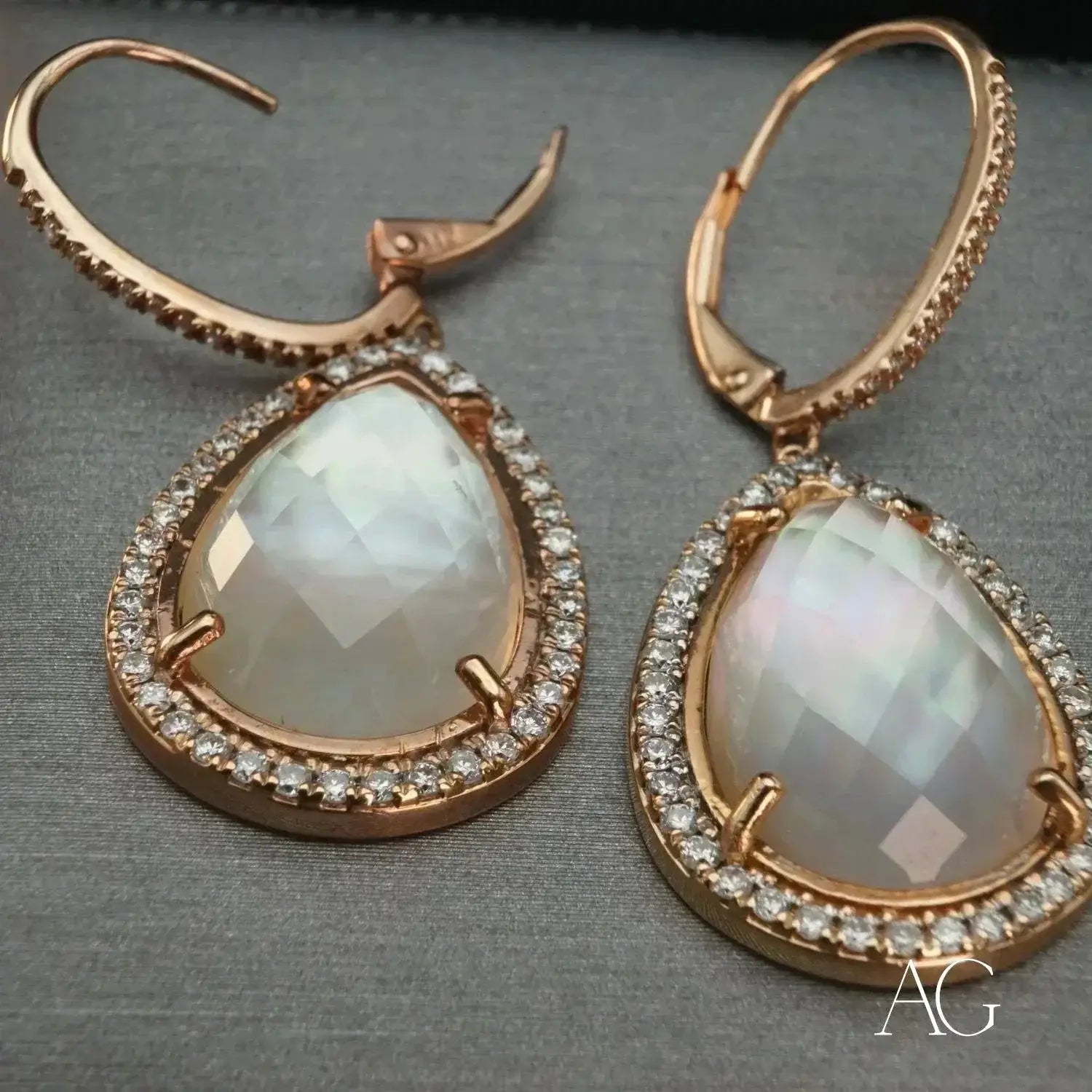 Elegant rose gold teardrop heirloom jewelry with moonstone and diamond halo