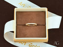 Elegant 18k gold diamond eternity band in luxury presentation box