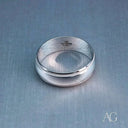 Elegant white 18k gold wedding band with brushed finish and milgrain edges