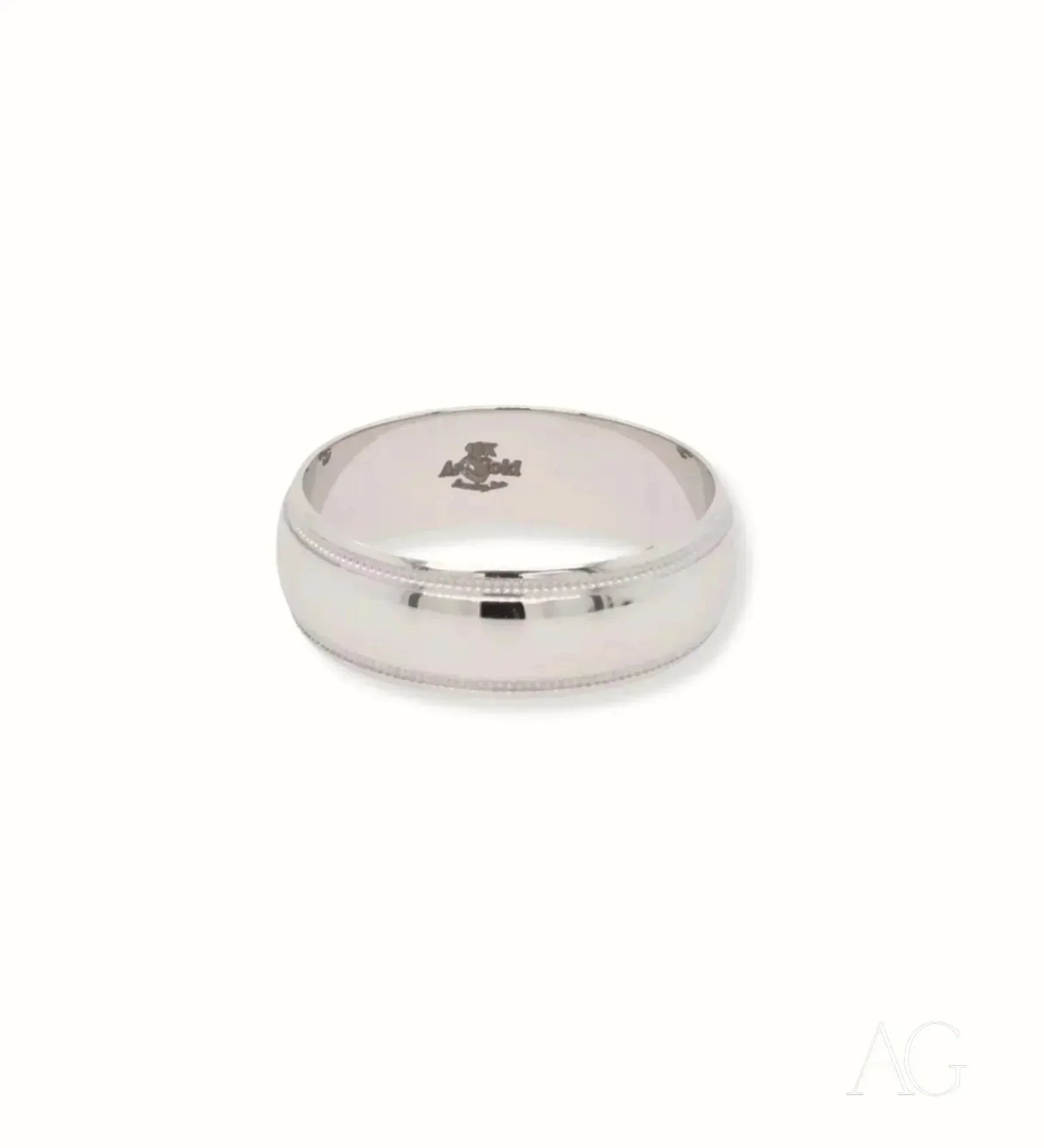 Elegant white 18k gold wedding band with beveled edges