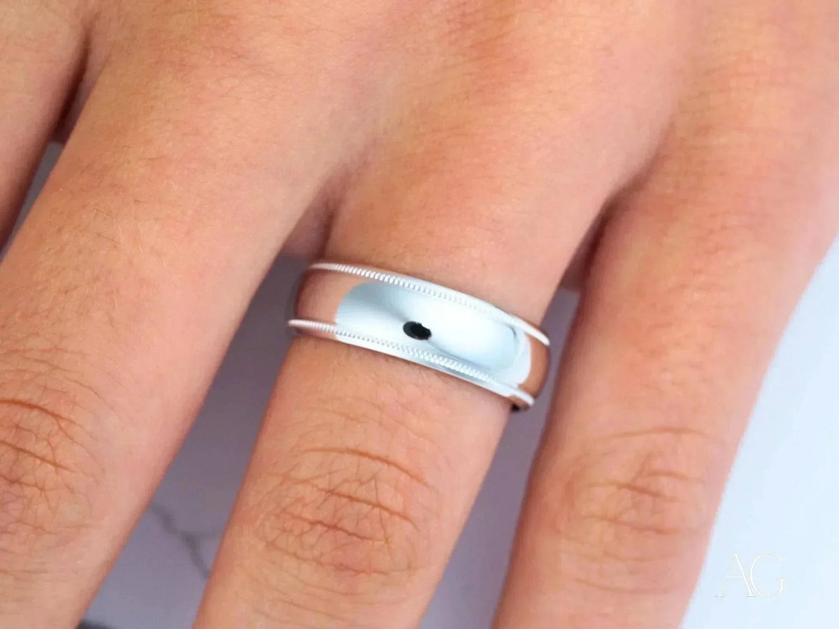 Elegant white 18k gold wedding band with silver ridged edges