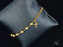 Elegant solid 18k gold bracelet with cross motif and polished gold beads