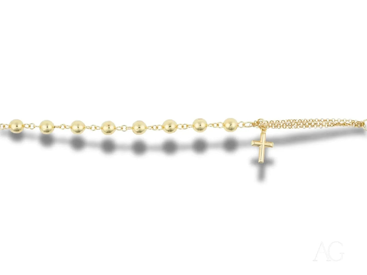 Elegant solid 18k gold bracelet with cross motif and polished gold beads
