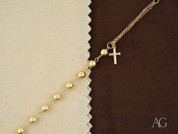 Elegant solid 18k gold bracelet with cross motif and polished gold beads