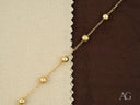 Elegant solid 18k gold bracelet with luxurious gold orbs
