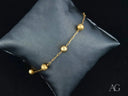 Elegant solid 18k gold bracelet with five luxurious gold orbs