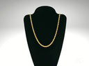 Timeless 18k gold rope chain necklace on black stand