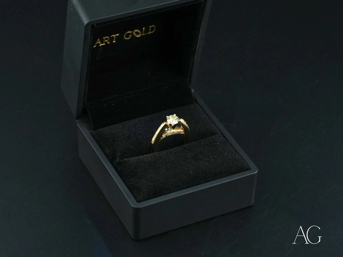 Open 18k gold light engagement ring with square diamond in black box
