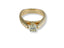 Yellow gold Embrace of Light engagement ring with cushion-cut diamond and pavé accents
