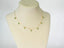 Gold chain necklace with marquise-cut emeralds and emerald droplets in 18k gold
