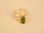 18k gold green tourmaline slide-on ring with rectangular baguette-cut green tourmaline gemstone