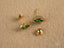 Gold stud earrings with green cubic zirconia and emerald halo in 18K gold green style