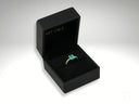 Emerald Majesty 18K gold ring with carat radiant-cut emerald in black velvet box