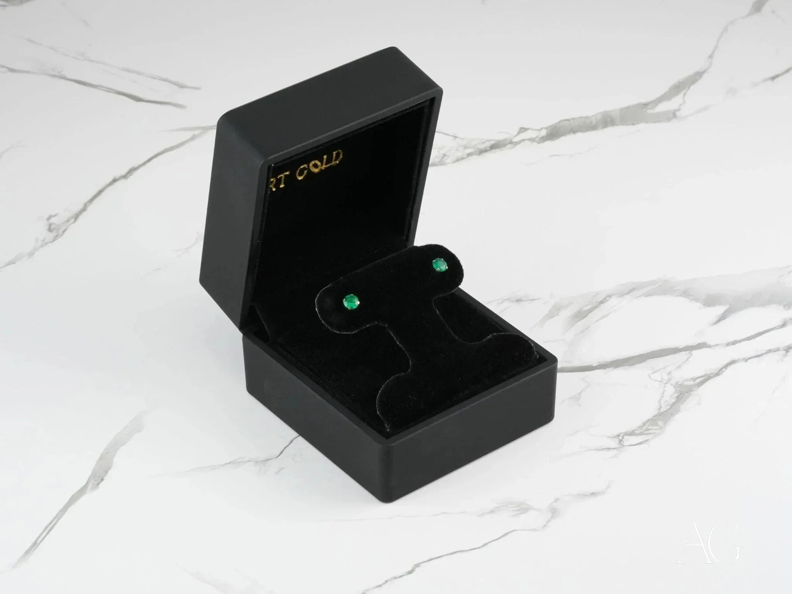 Emerald Radiance 18k gold green cubic zirconia stud earrings in black box