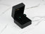 Black jewelry box with Emerald Radiance Earrings featuring green cubic zirconia in 18k gold green setting