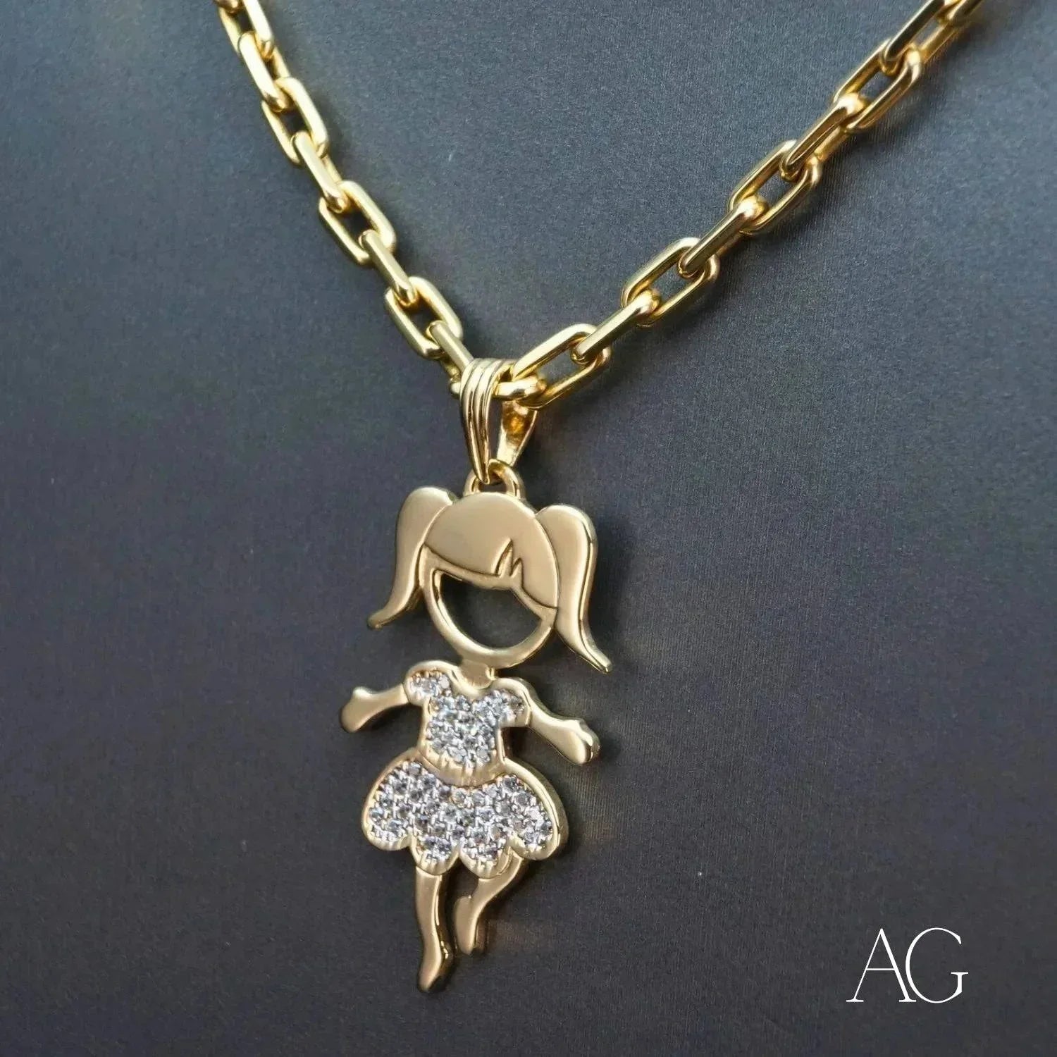 Enchanting 18K gold Girl doll pendant with CZ dress hanging from a gold chain