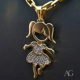 Enchanting 18K gold Girl doll pendant with CZ-accented dress shown on a chain