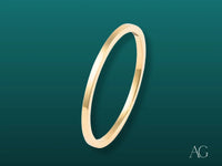 Polished gold flat-edged bangle from Essence Linea 1mm art gold jewelry