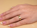18k yellow gold Essence Linea 5mm ring on hand