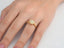 Eternal Embrace engagement ring featuring a yellow gold halo design with an eternal love diamond