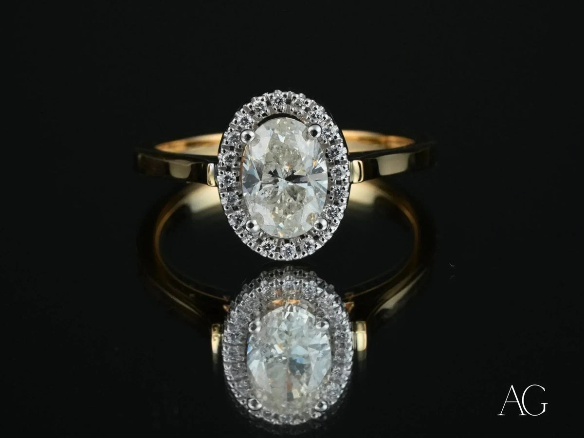 Oval diamond eternal halo engagement ring in yellow gold