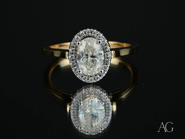 Oval diamond eternal halo engagement ring in yellow gold