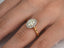 Eternal Halo Engagement Ring featuring an oval diamond and delicate halo setting