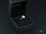 Eternal Halo Engagement Ring with oval diamond and delicate halo in black box