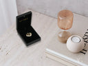 Black 18k solid gold Eternal Heart Pendant in open jewelry box