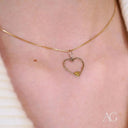 Eternal love pendant: gold chain with elegant heart design and inner glint