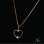 Gold chain necklace with silver heartfelt glint pendant featuring an elegant heart design