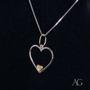 Eternal love pendant with elegant heart design in silver and gold