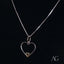 Silver necklace with heartfelt glint pendant featuring an elegant heart design and gold accent
