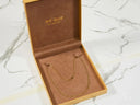 Eternal Prestige 18K Gold Figaro Chain in Open Brown Jewelry Box