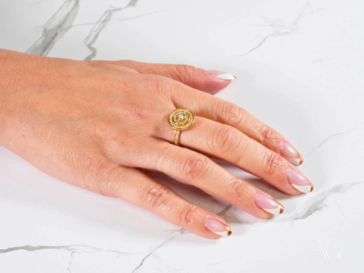 Eternal Radiance Ring with central cubic zirconia stone on French-tipped hand