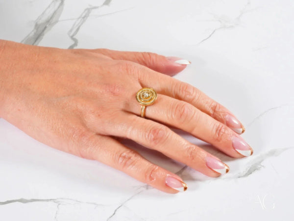 Eternal Radiance Ring with central cubic zirconia stone on French-tipped hand