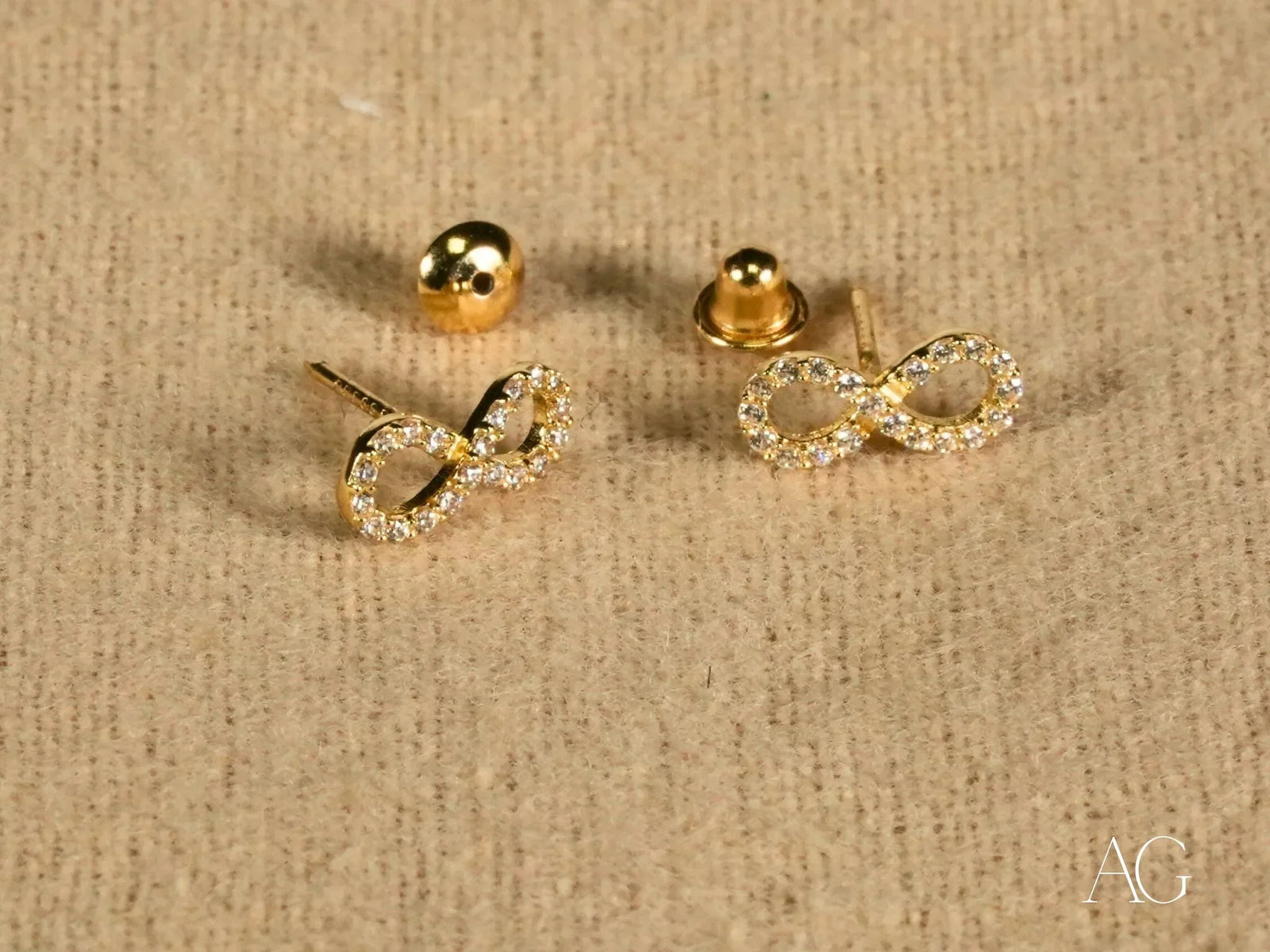 Eternal Spark 18K gold infinity CZ stud earrings with backs